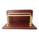 Letter holder covered in leather and golden metal by roche design