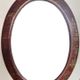 Oval Chinese mirror in leather style