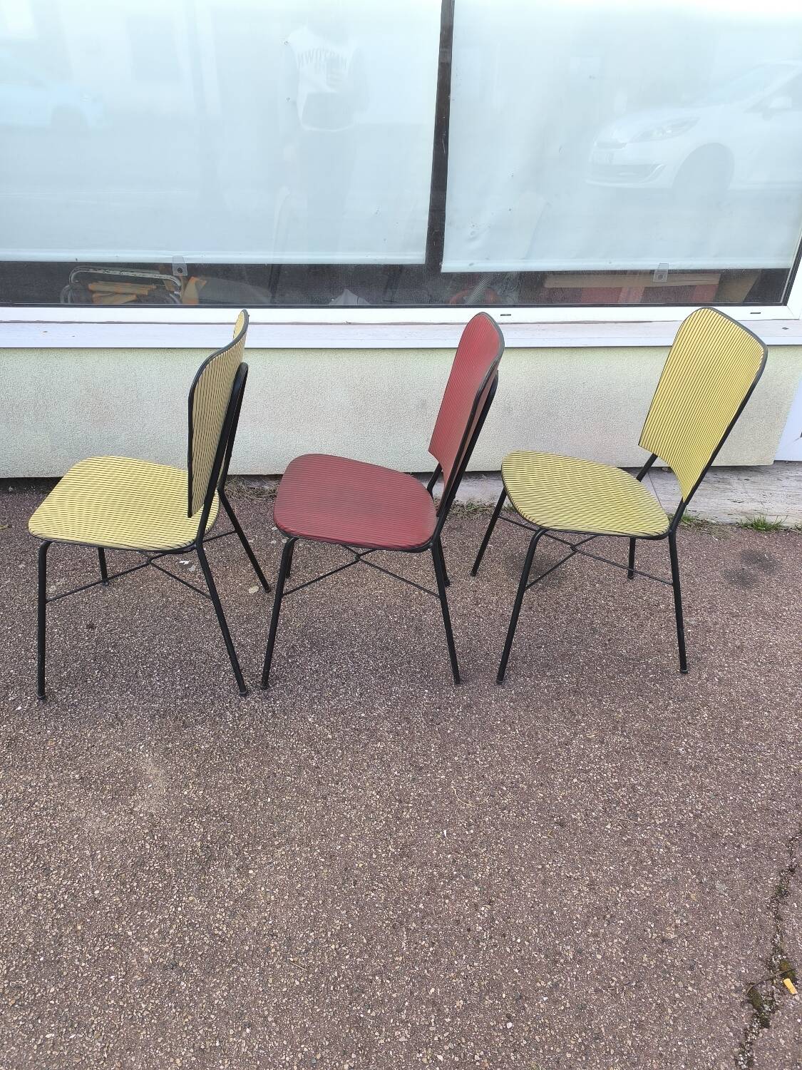 Set of 3 vintage yellow and red faux leather chairs.