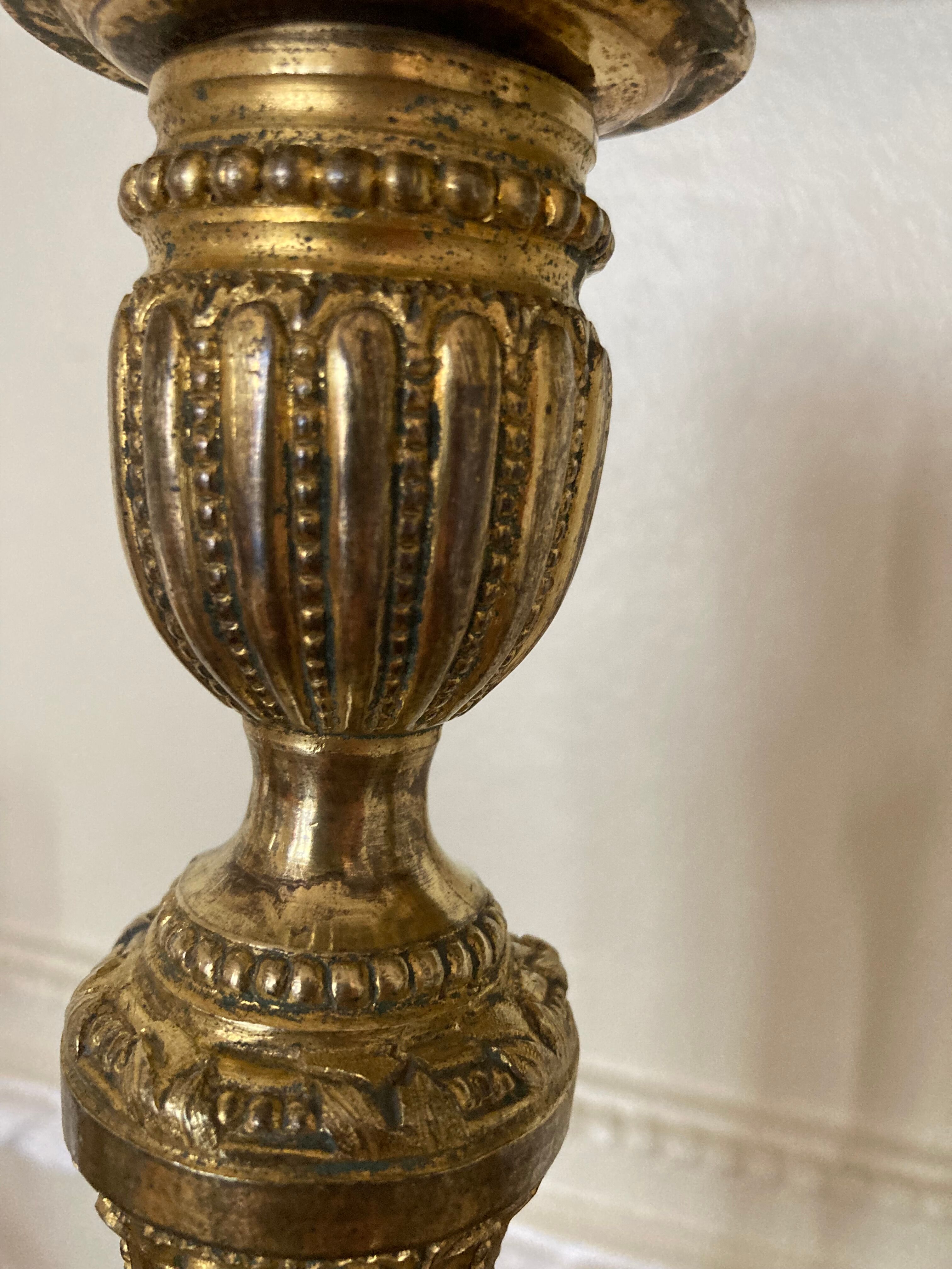Pair of Louis XVI torch candlesticks in gilded bronze