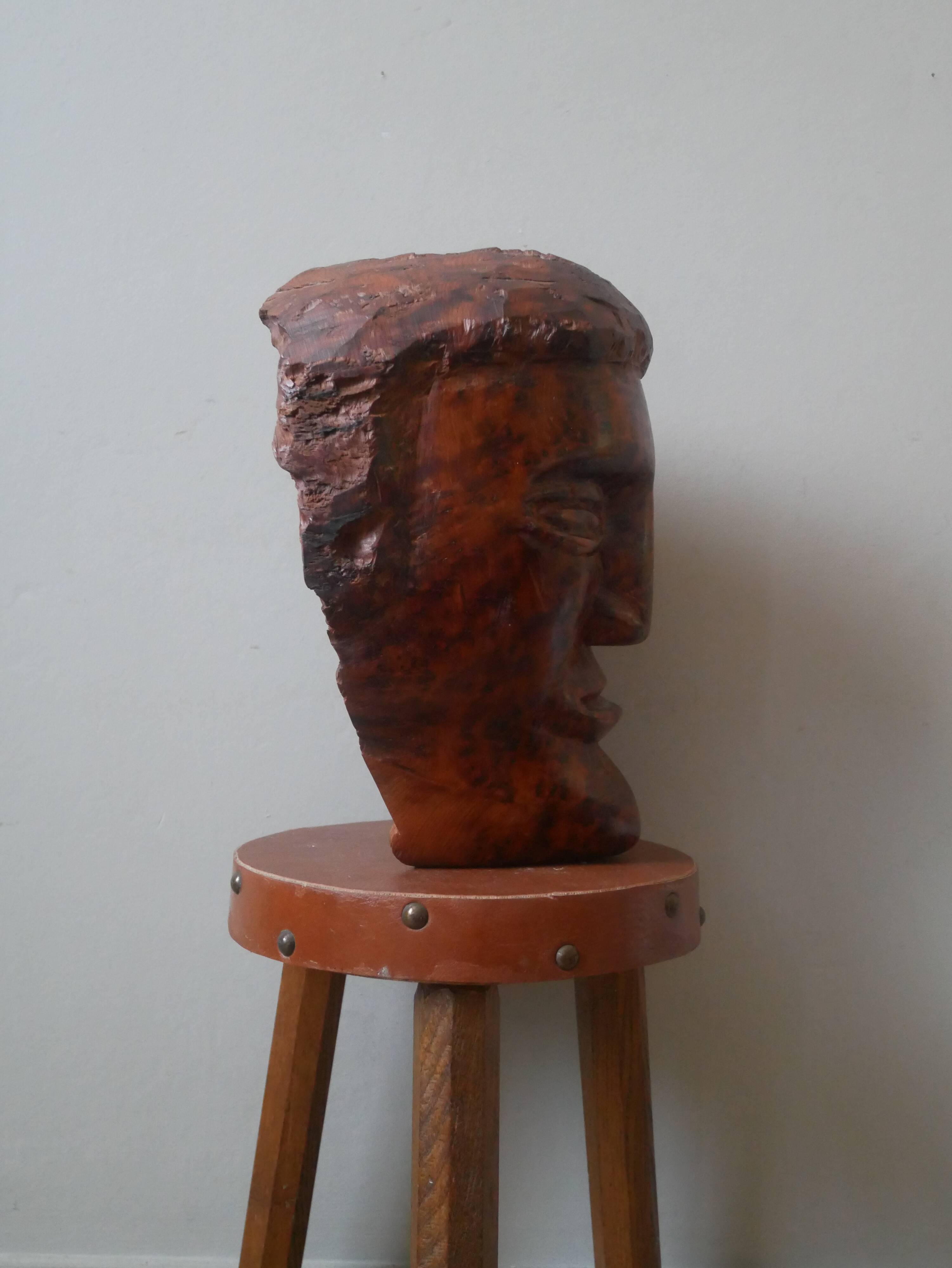 Wooden sculpture ethnic man's head handcrafted tribal decorative object workshop
