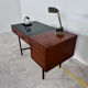 French modernist desk from the 1950s with 2 drawers, 1 cabinet, and 1 container.