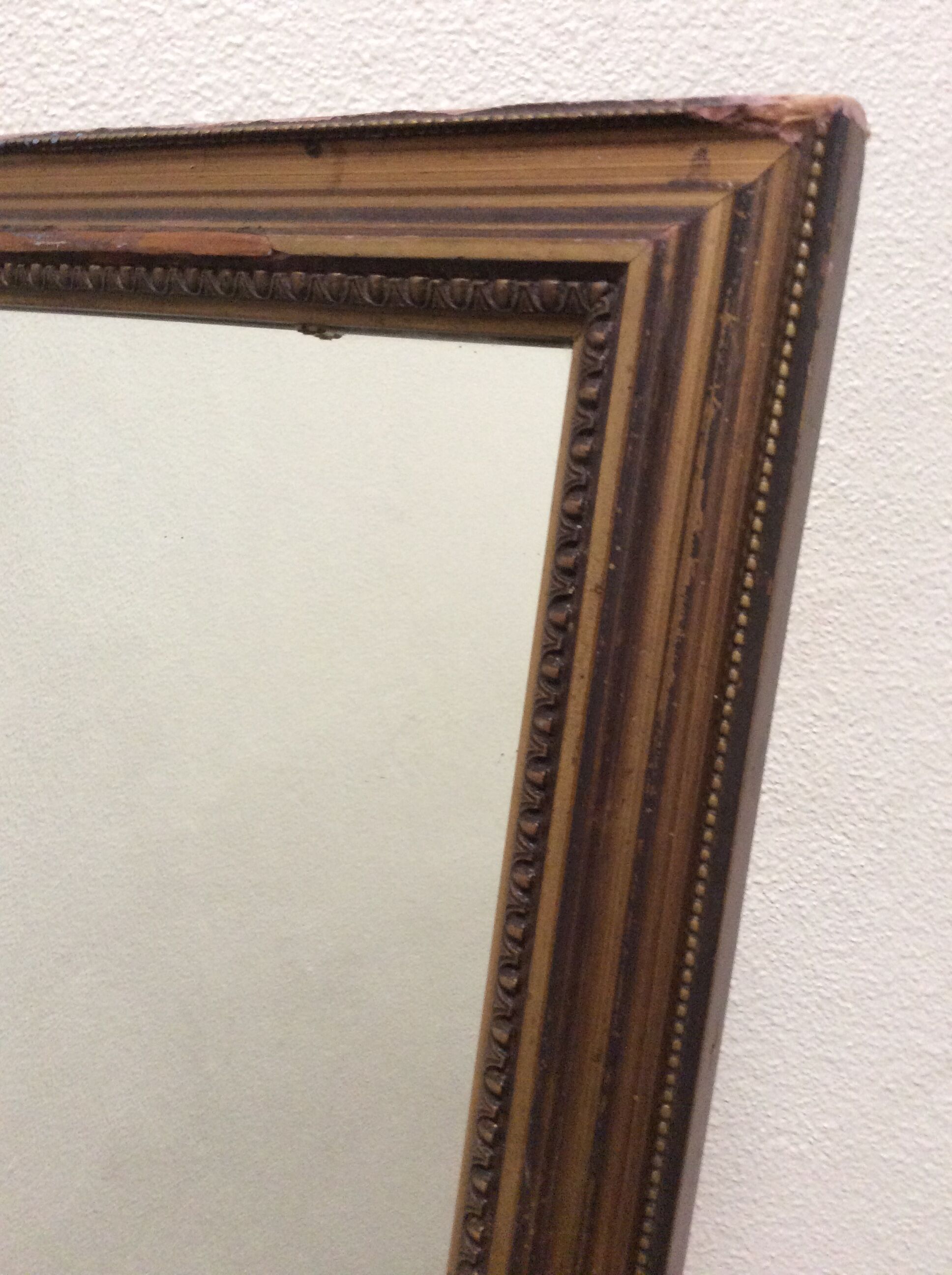 Framed mirror in bronze