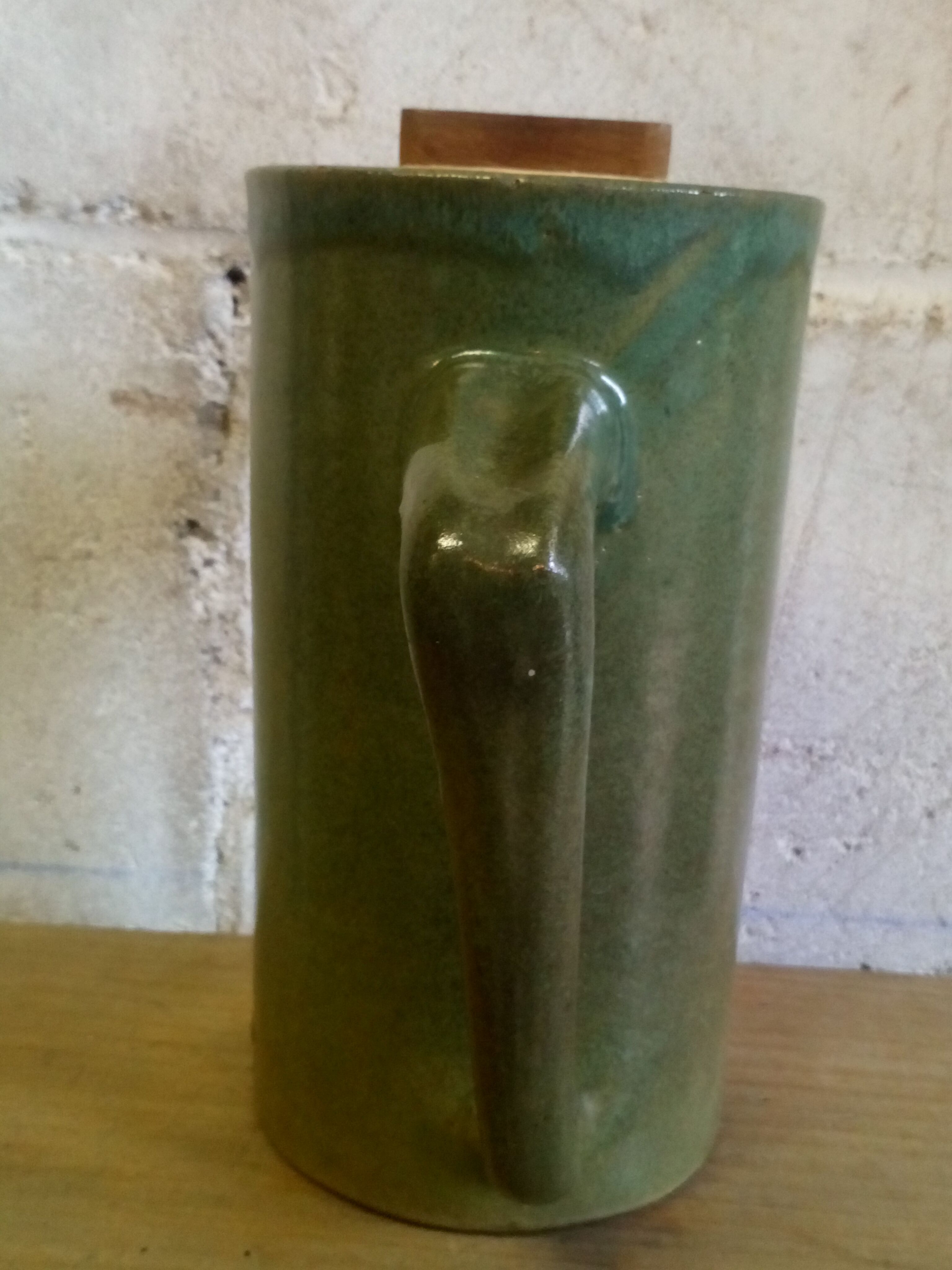 Green emailed sandstone teapot