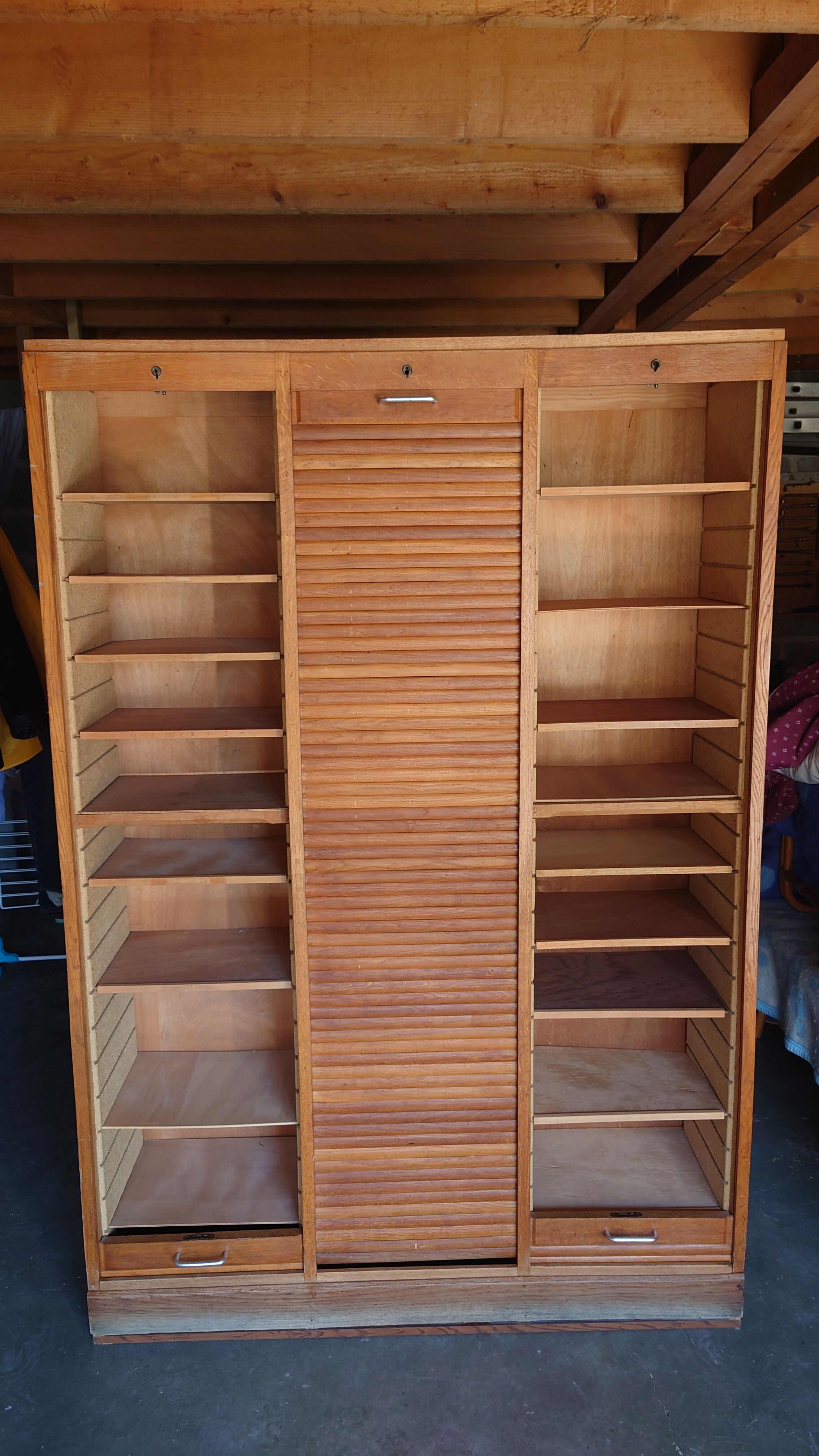 Filing cabinet has curtains, notary furniture. 3 columns