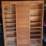 Filing cabinet has curtains, notary furniture. 3 columns