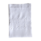 old pillowcase embroidered with fine flowers, marked MP, 19th
