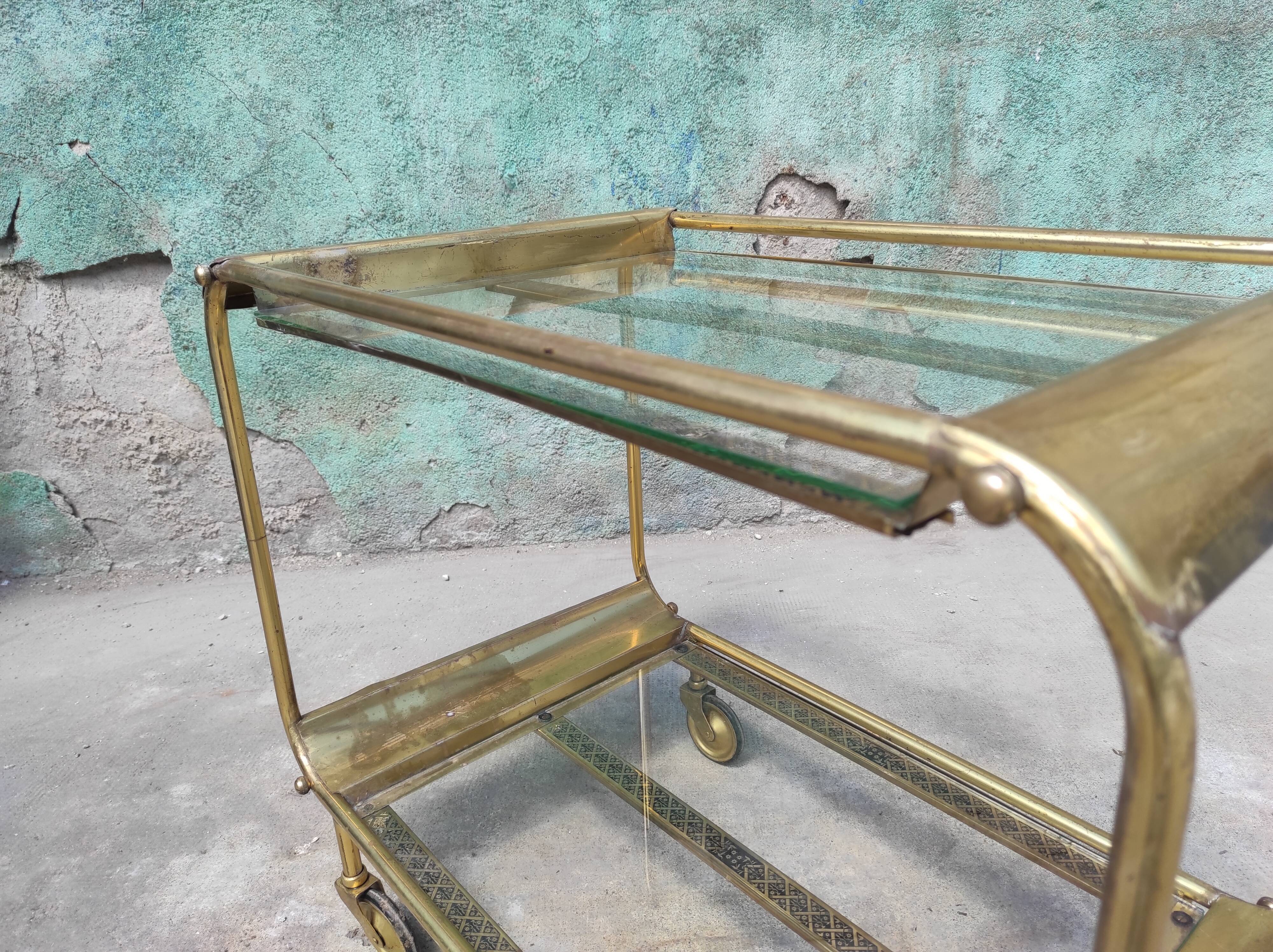 Old rolling coffee table serving vintage brass bar 50s mid-century design