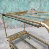 Old rolling coffee table serving vintage brass bar 50s mid-century design