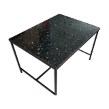 Coffee table with top in silver granite and welded steel base.