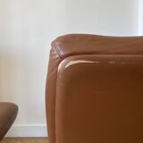 Pair of cognac-colored swivel armchairs