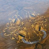Coffee table in walnut with maple inlays and wheels
