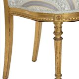 Pair of Louis XVI style chairs in gilded wood.