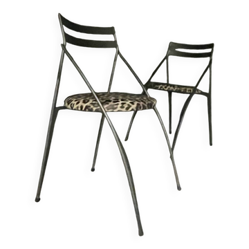 Pair of folding chairs from the 80s with leopard print seats.