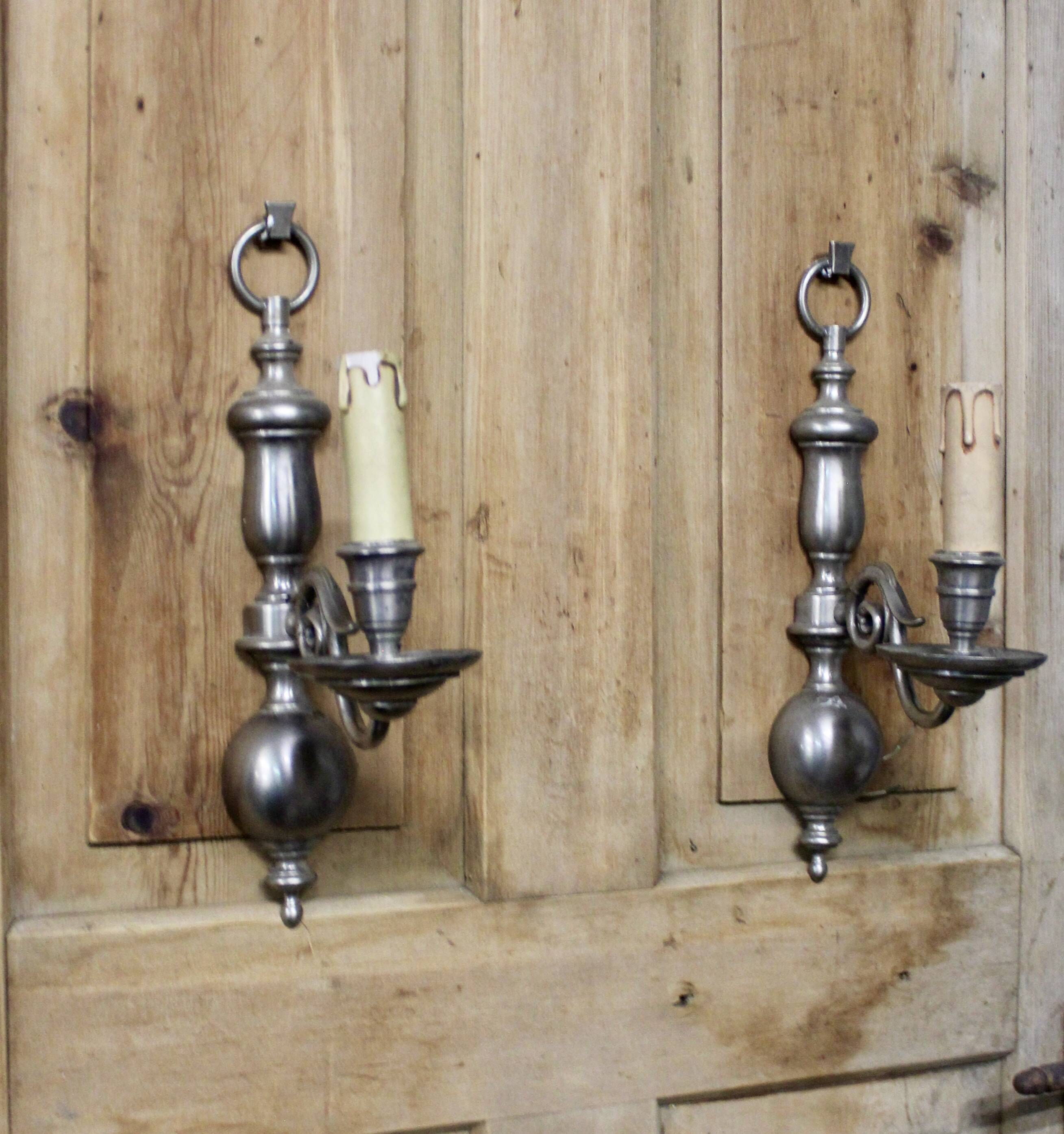 Pair of pewter-colored bronze wall sconces