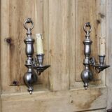 Pair of pewter-colored bronze wall sconces