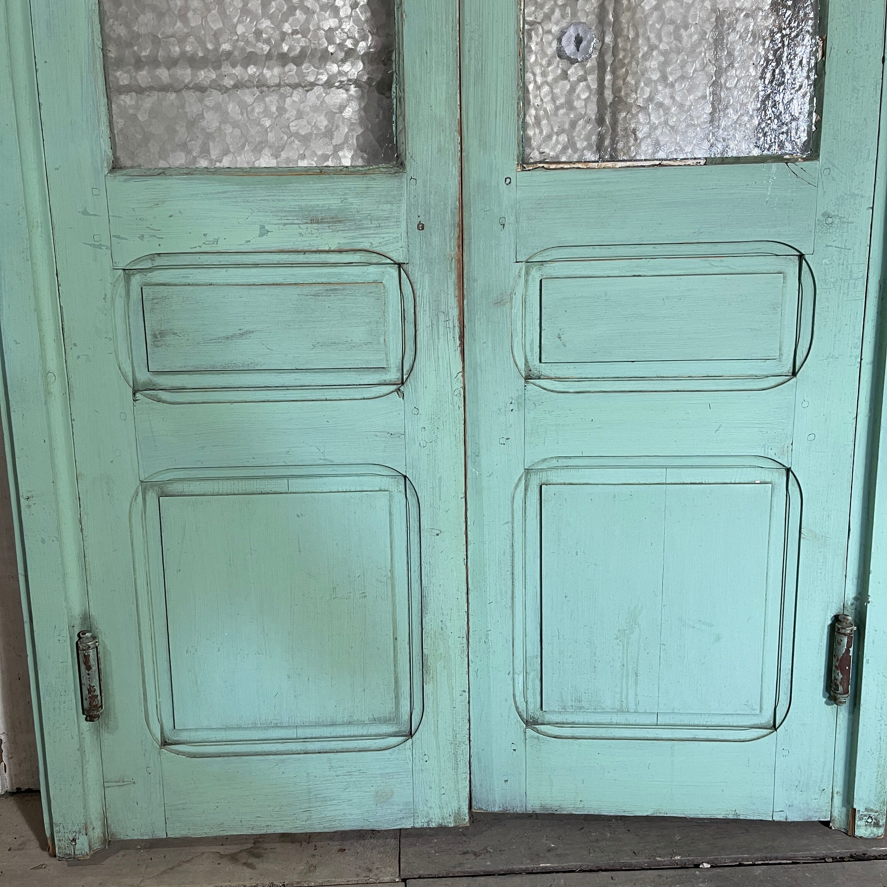 Old pair of saloon type glass doors