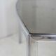 Living table. chrome metal, curved smoked glass slab, france, circa 1970.