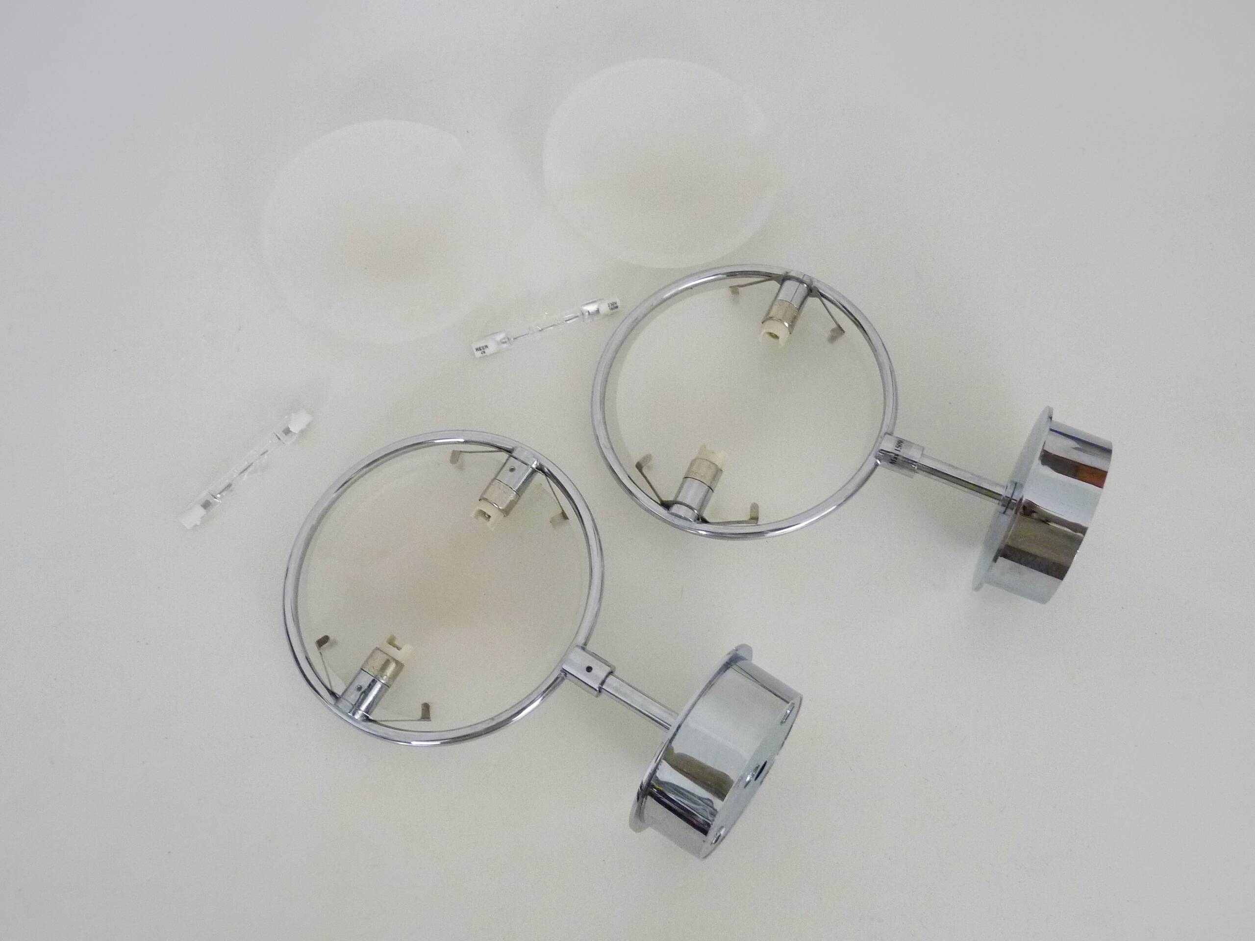 Pair of Italian Fontana Arte Nobi wall lights in chrome metal and satin glass.