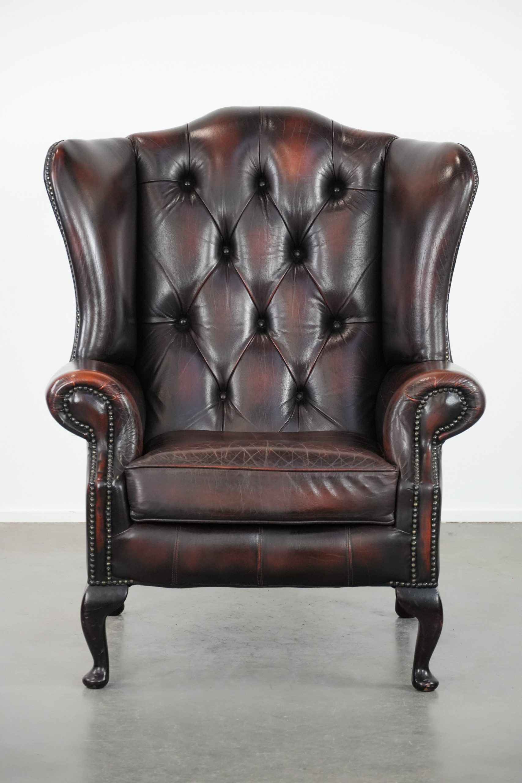 Cowhide leather Chesterfield wingback armchair in classic English style