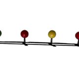 Metal coat rack in the style of Féraud