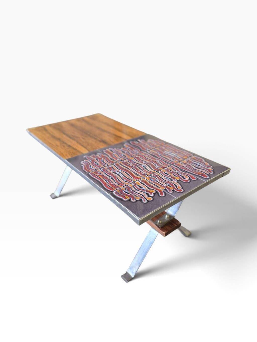 Vintage chrome coffee table with ceramic accent.