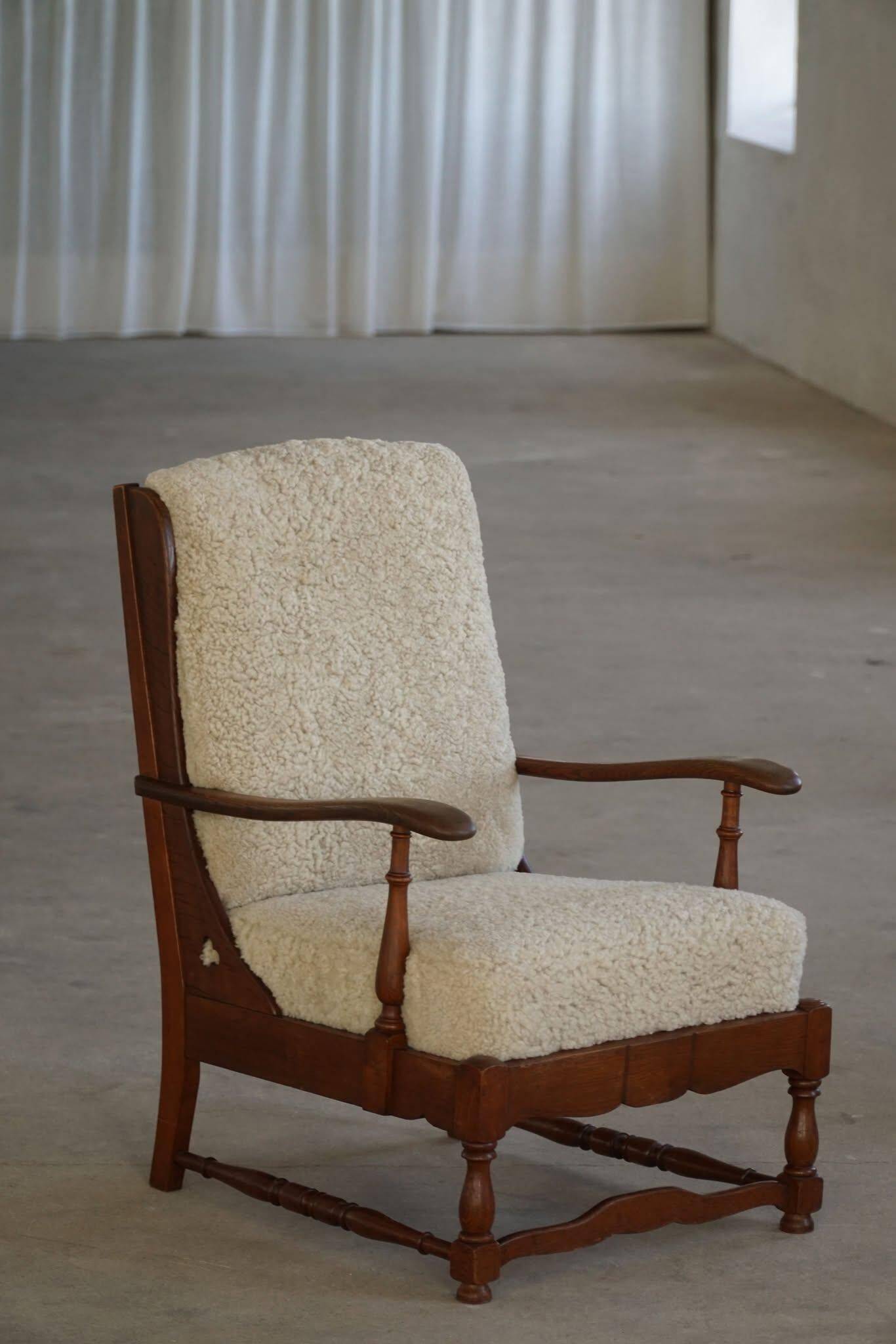 Modern Danish design, a pair of high-backed armchairs in oak and lambswool, 1950s.