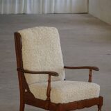Modern Danish design, a pair of high-backed armchairs in oak and lambswool, 1950s.