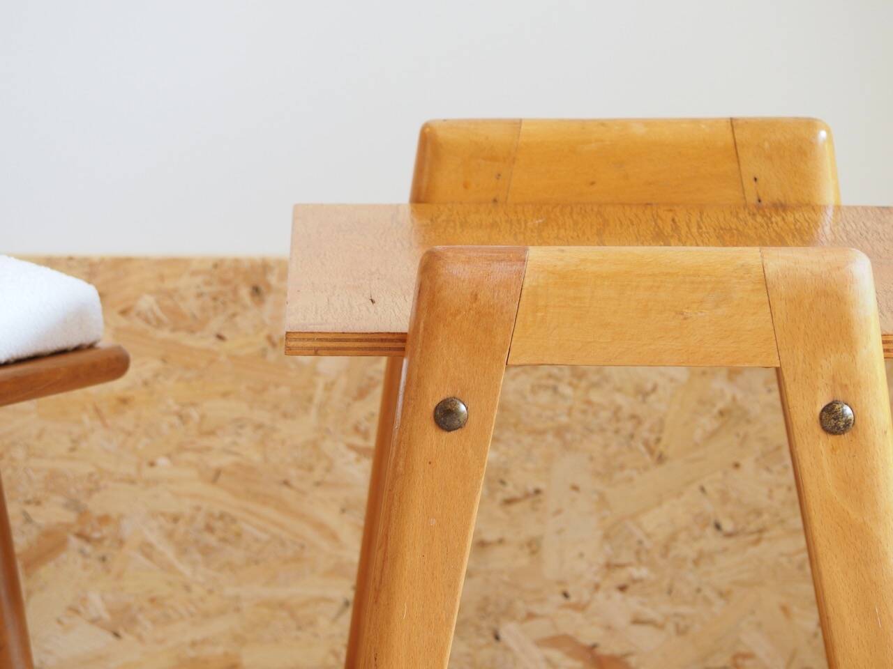Bedside or side table with compass legs.