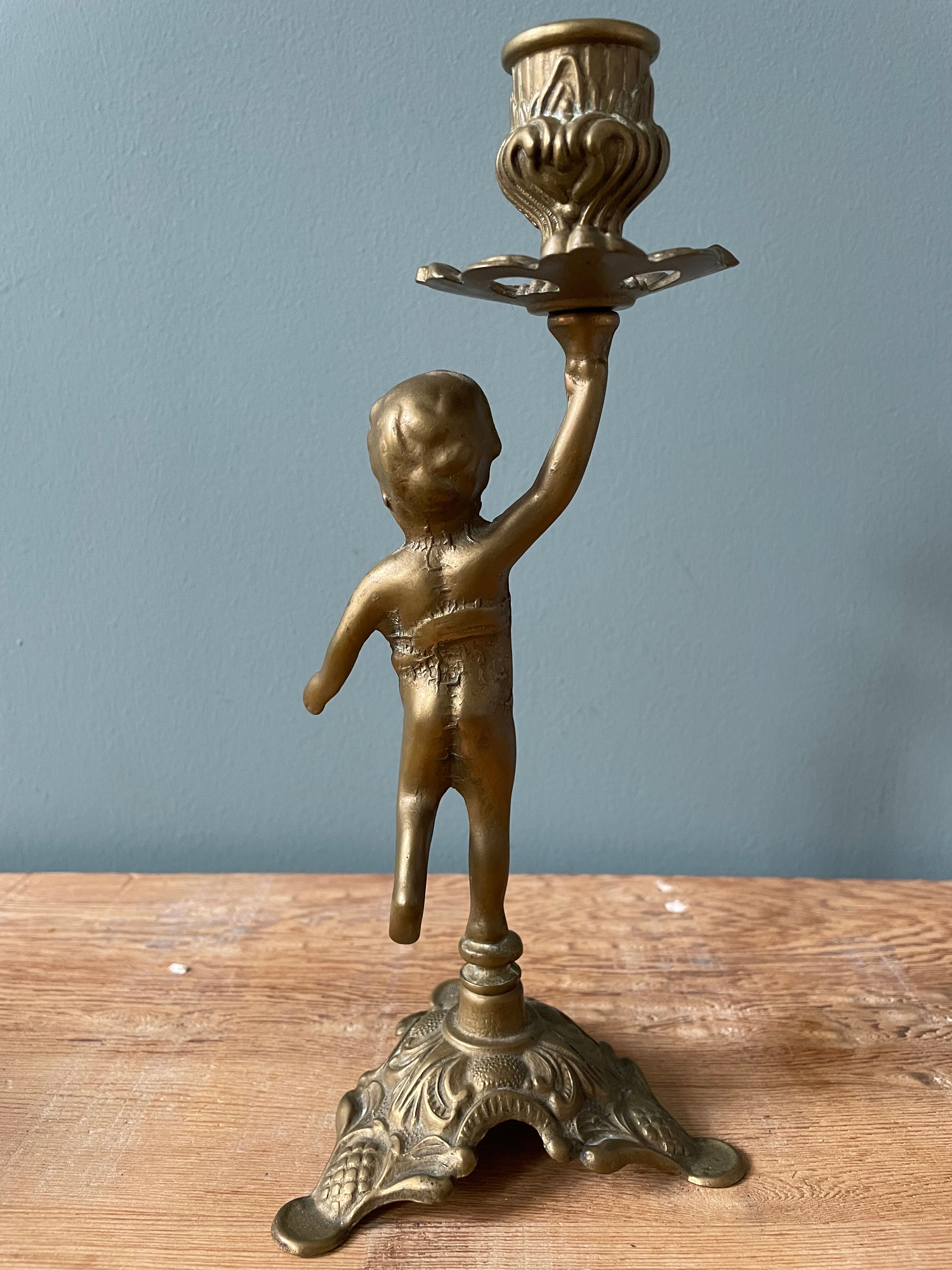 Old candlestick candlestick cherub in bronze