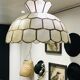 Suspension fleur nacre et laiton