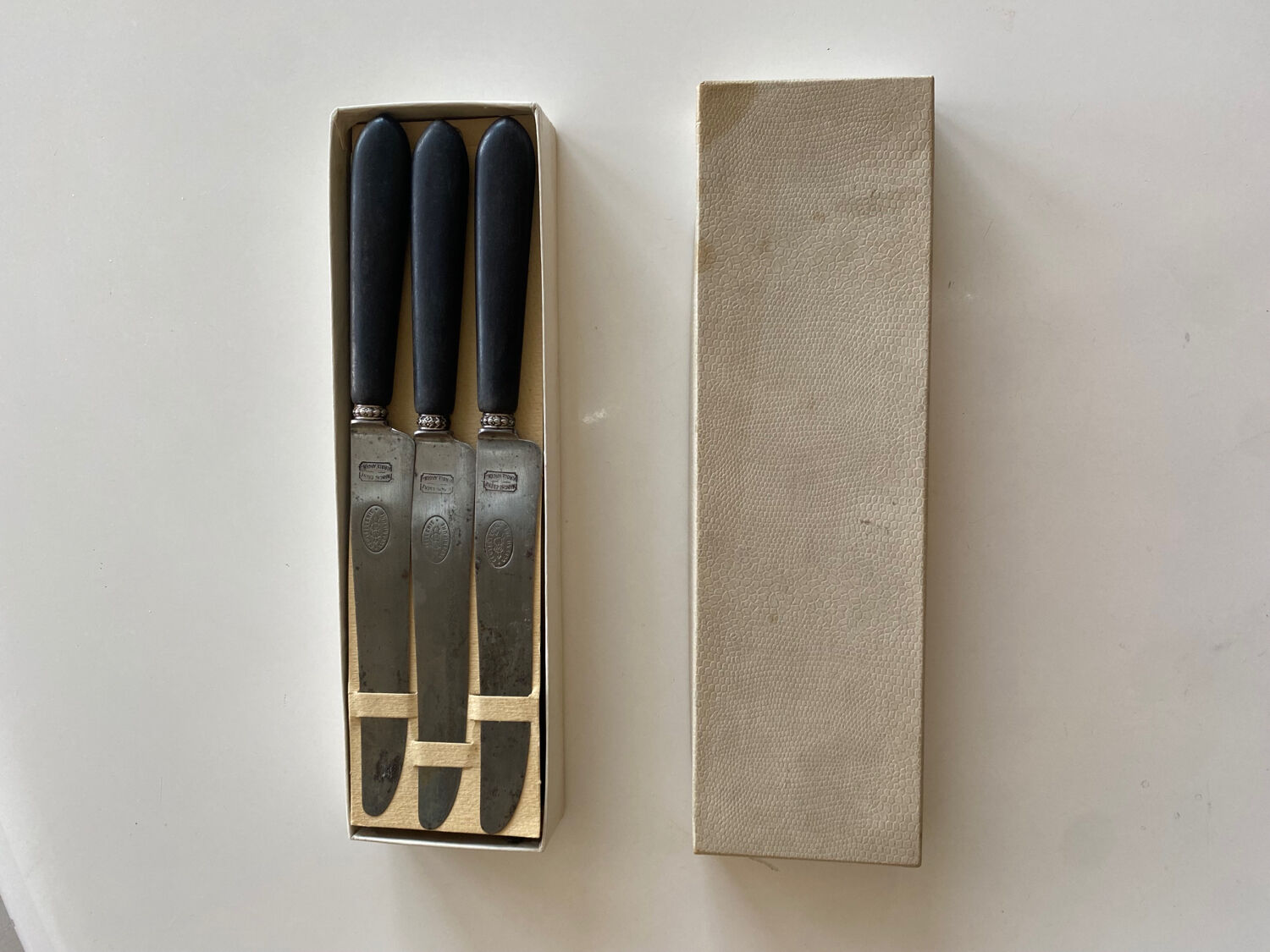 Antique table knives in ebony and steel blade