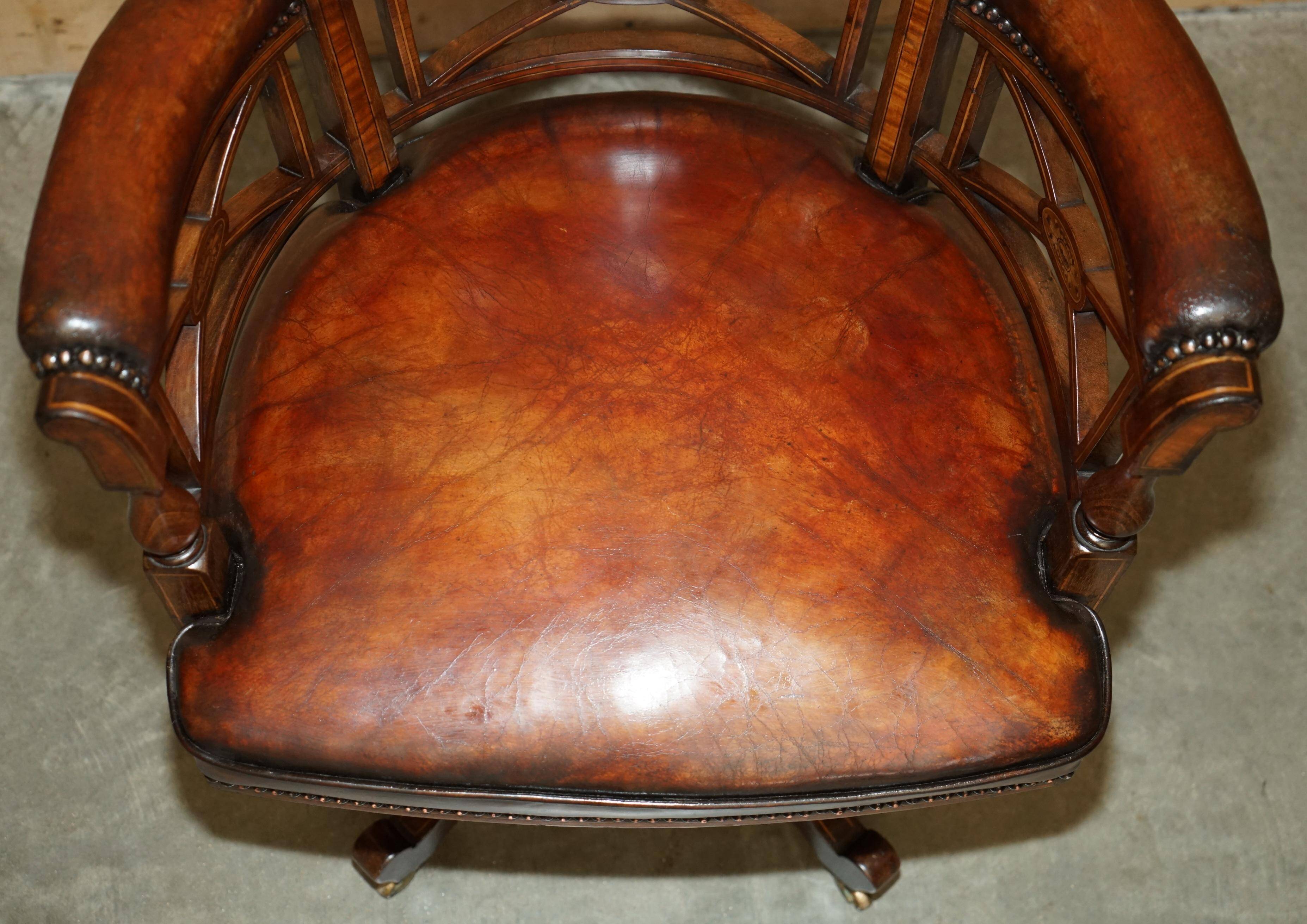 Victorian captain's chair in leather restored by Cornelius V Smith.