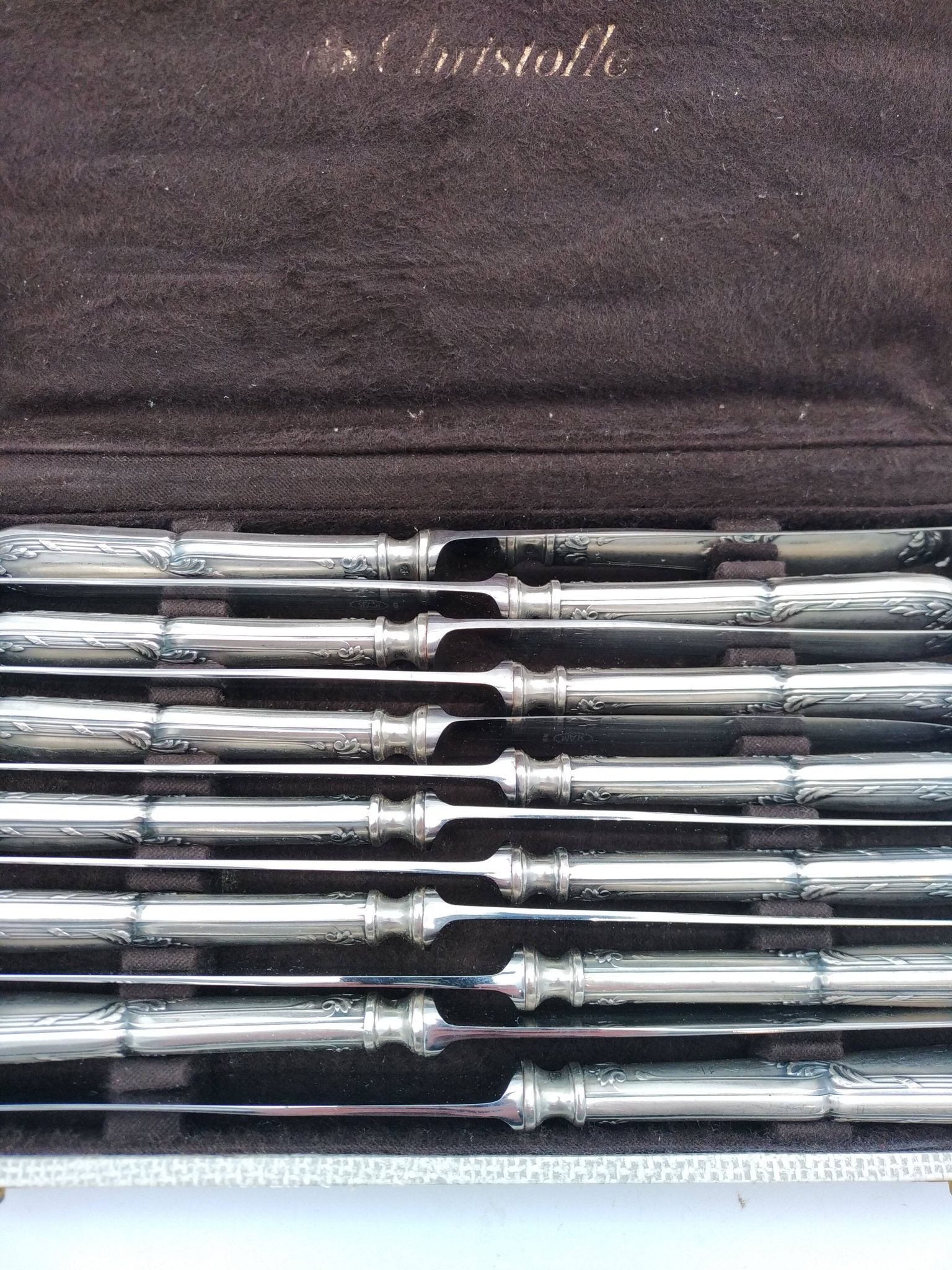 Set of 12 sfam knives in silver metal and stainless steel blades.