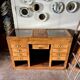 Counter, glass-fronted wooden workbench in dark wood, 8 drawers.