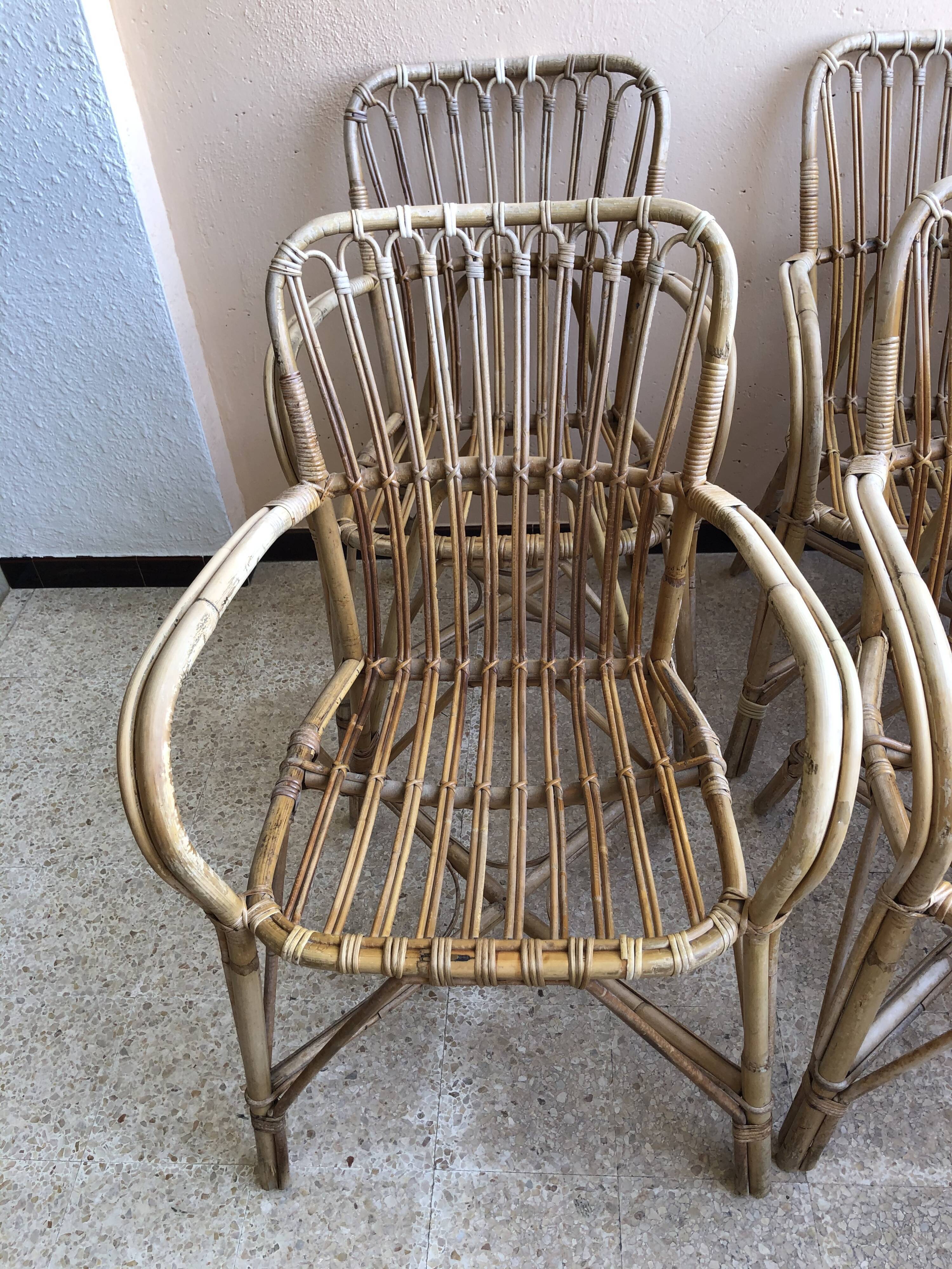 Series of 4 vintage rattan armchairs