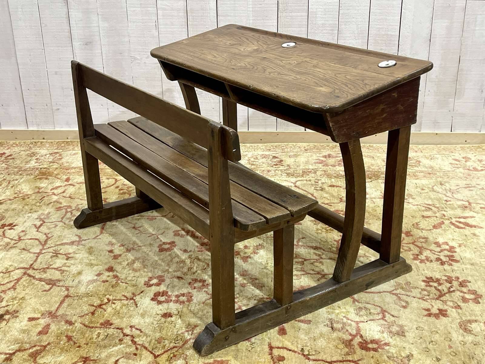 Early 20th-century oak school desk with porcelain inkwells