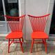 Pair of vintage red Scandinavian IKEA chairs.