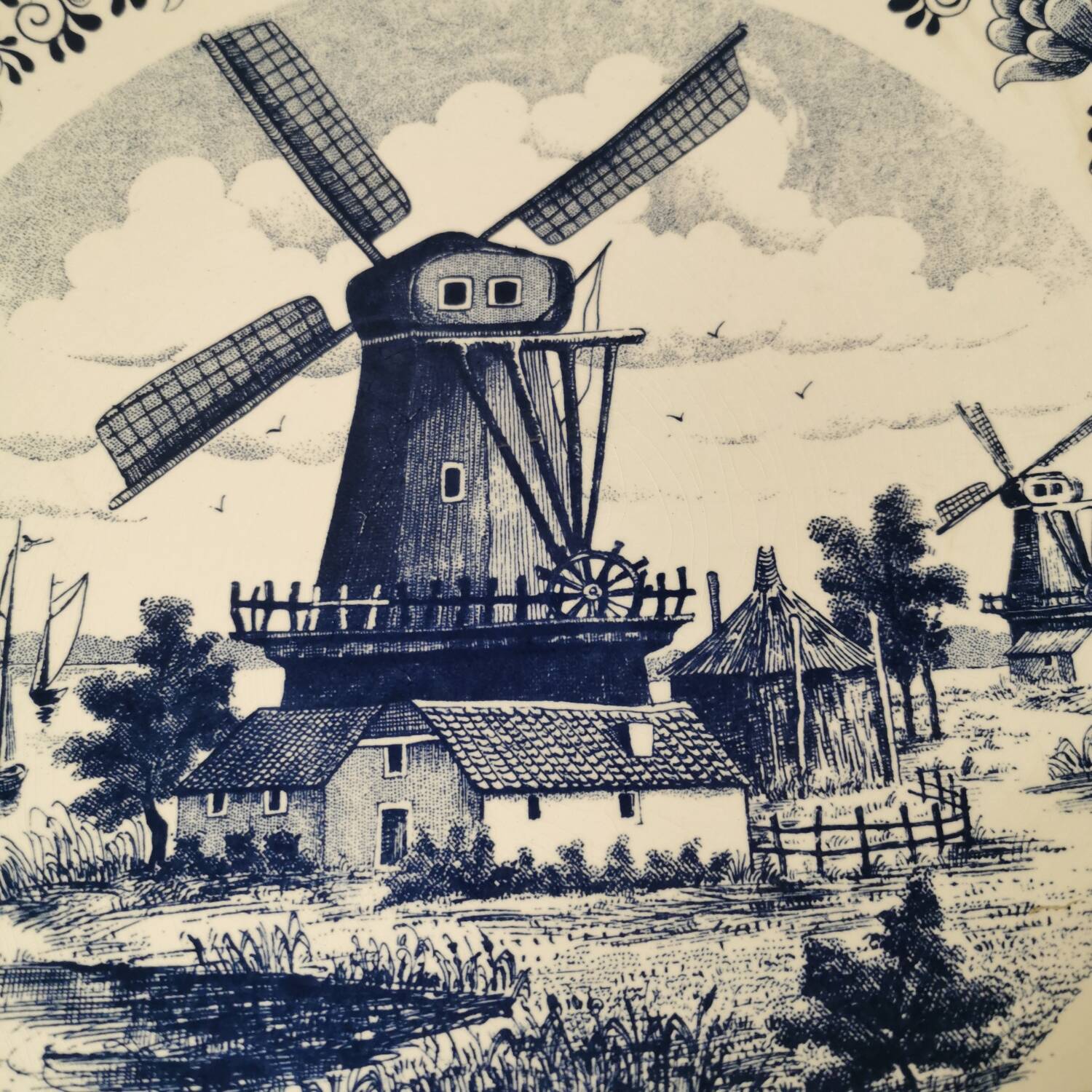 Delft earthenware dish decorated with a mill late 19th early 20th century diameter 39 cm