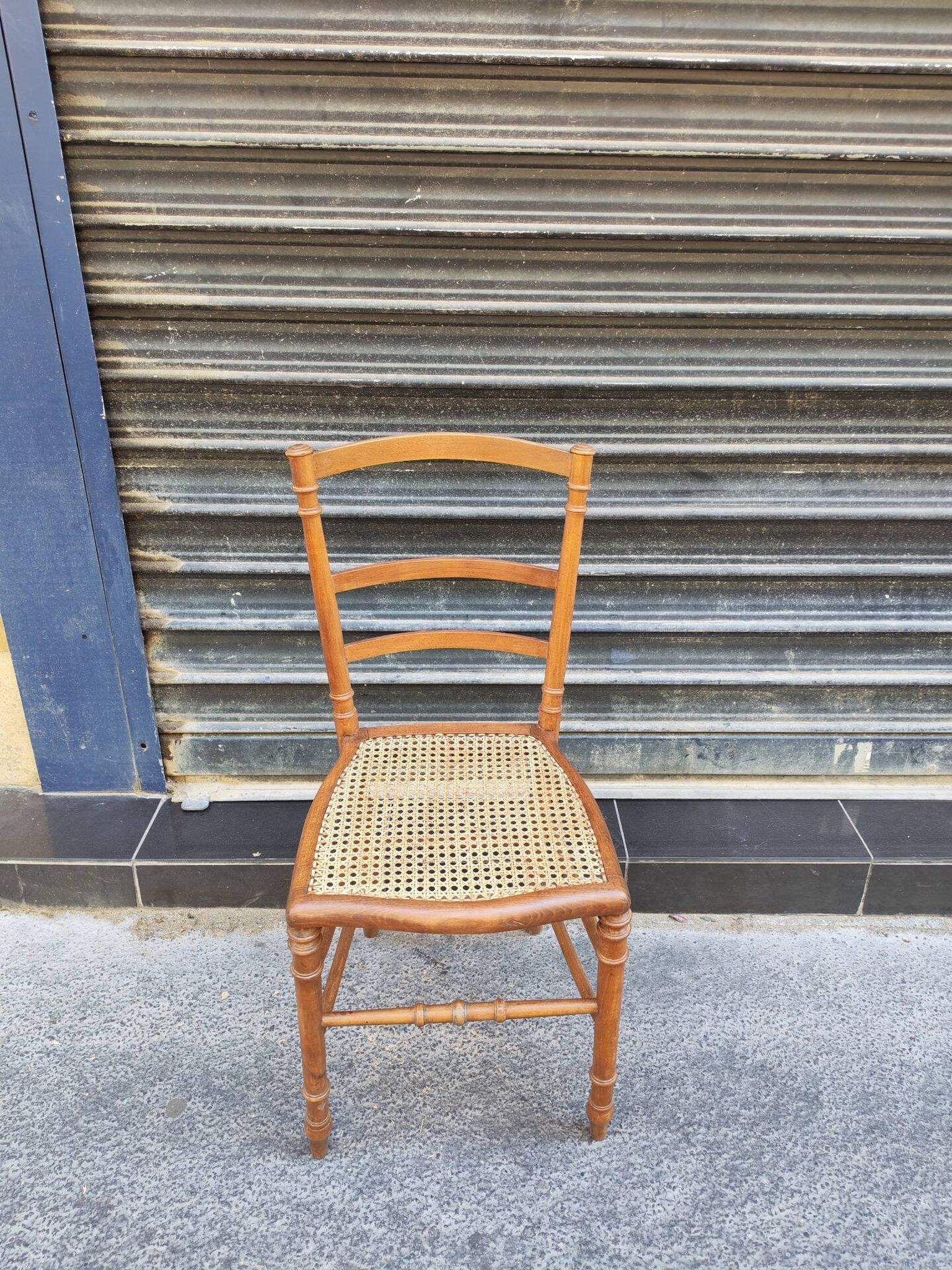 Antique wooden chair with cane seating