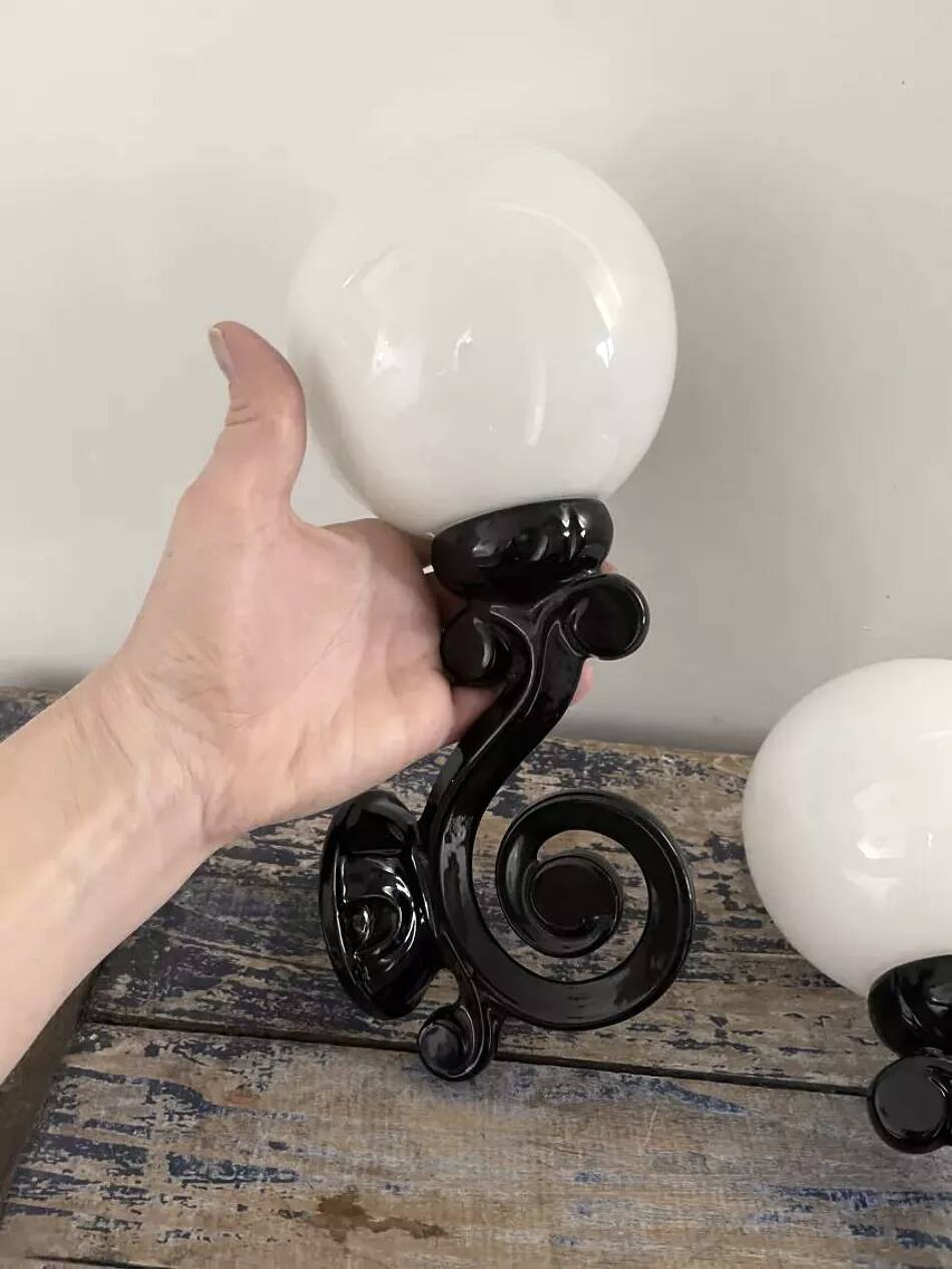 Pair of vintage enameled cast iron wall sconces