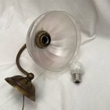 Brass wall light with a glass globe dimension: height -21cm- width -27cm-