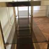 Pair of consoles brass shelves and smoked glass design Roche Bobois