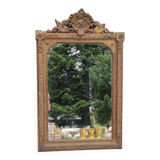 Old gilded mirror with pediment