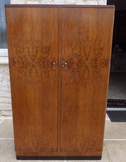 Wardrobe on a plinth in walnut and walnut veneer circa 1940.