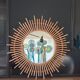 Very large sun mirror in rattan.
