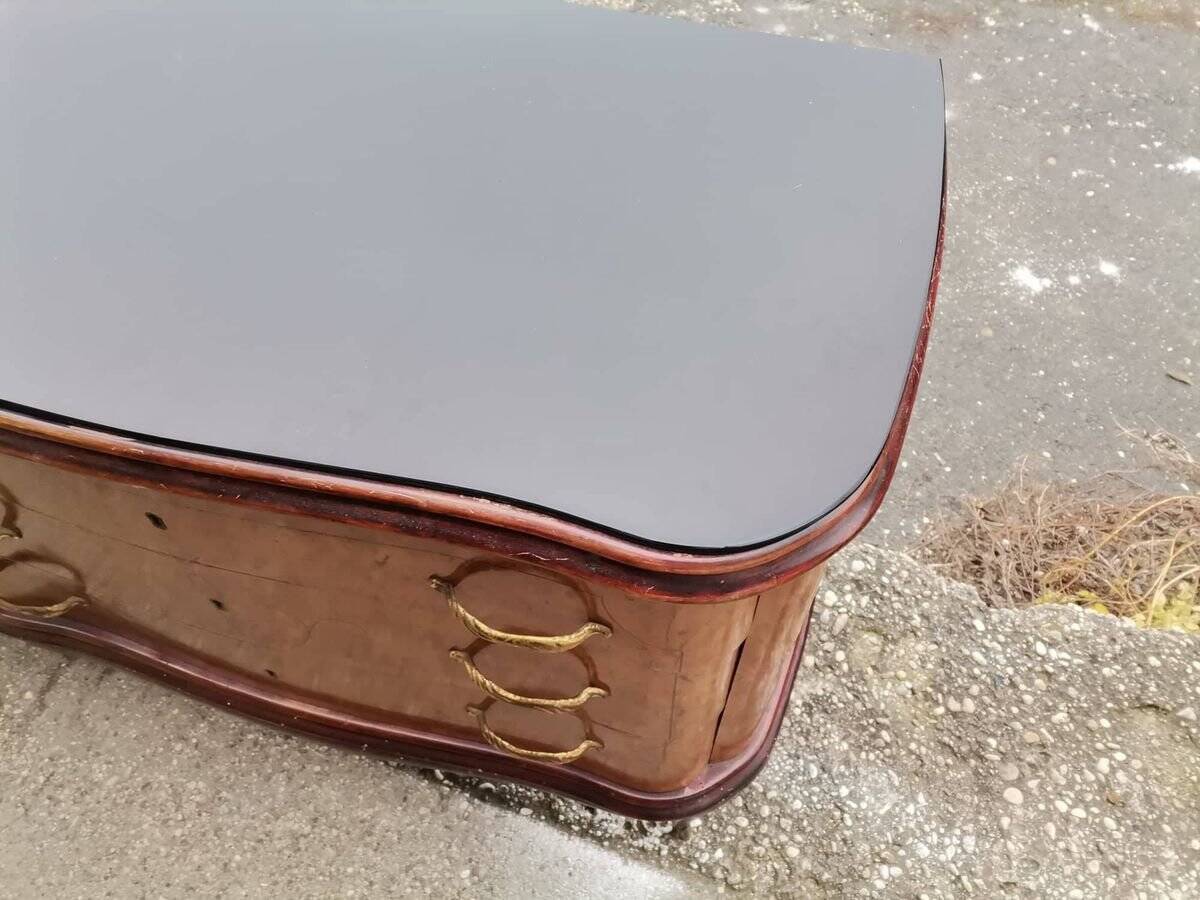 Mid-century Italian brown wooden chest of drawers, black glass top and brass handles.