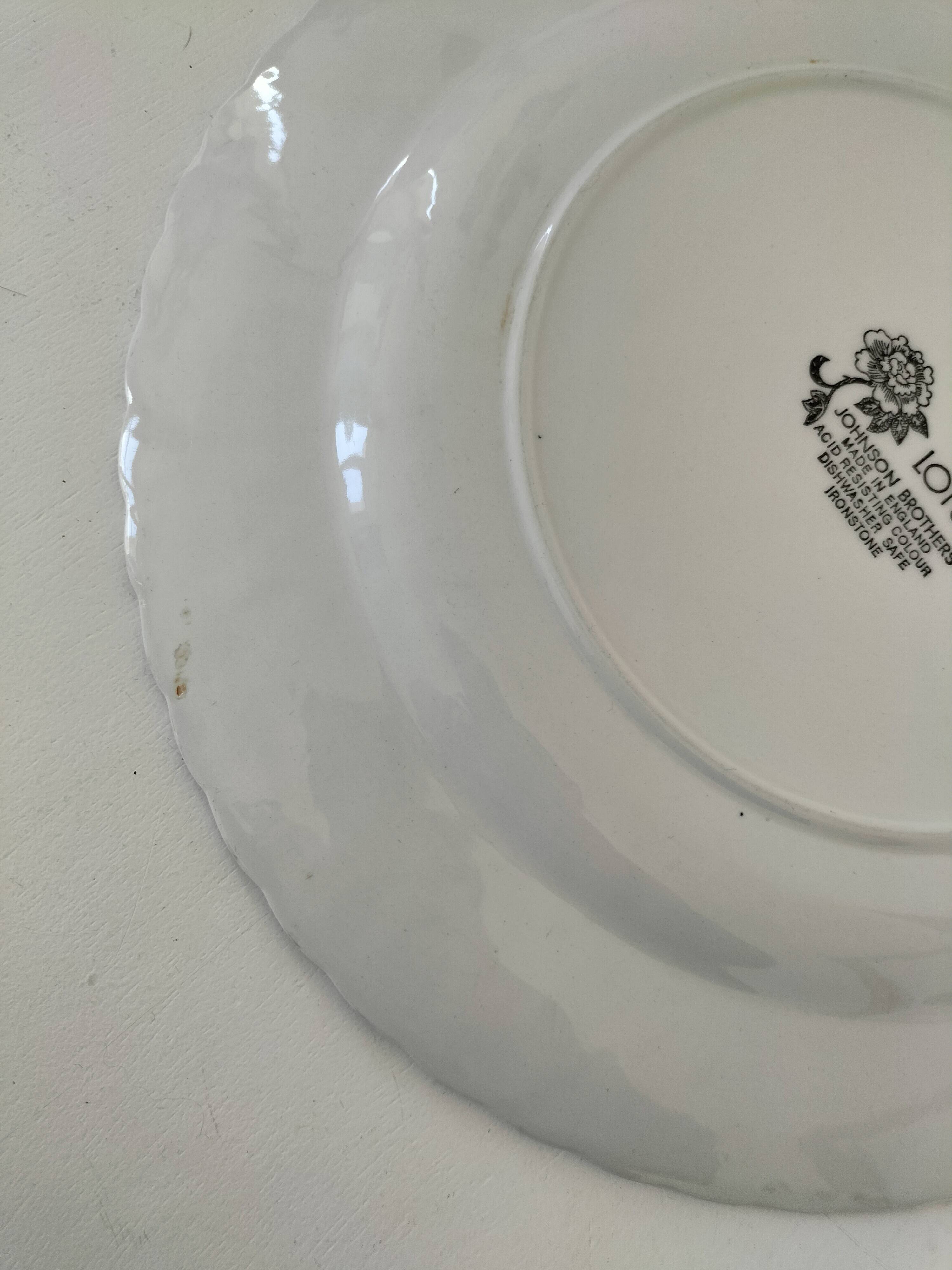 Round antique plate by Johnson Brothers in the Blue Lotus pattern.