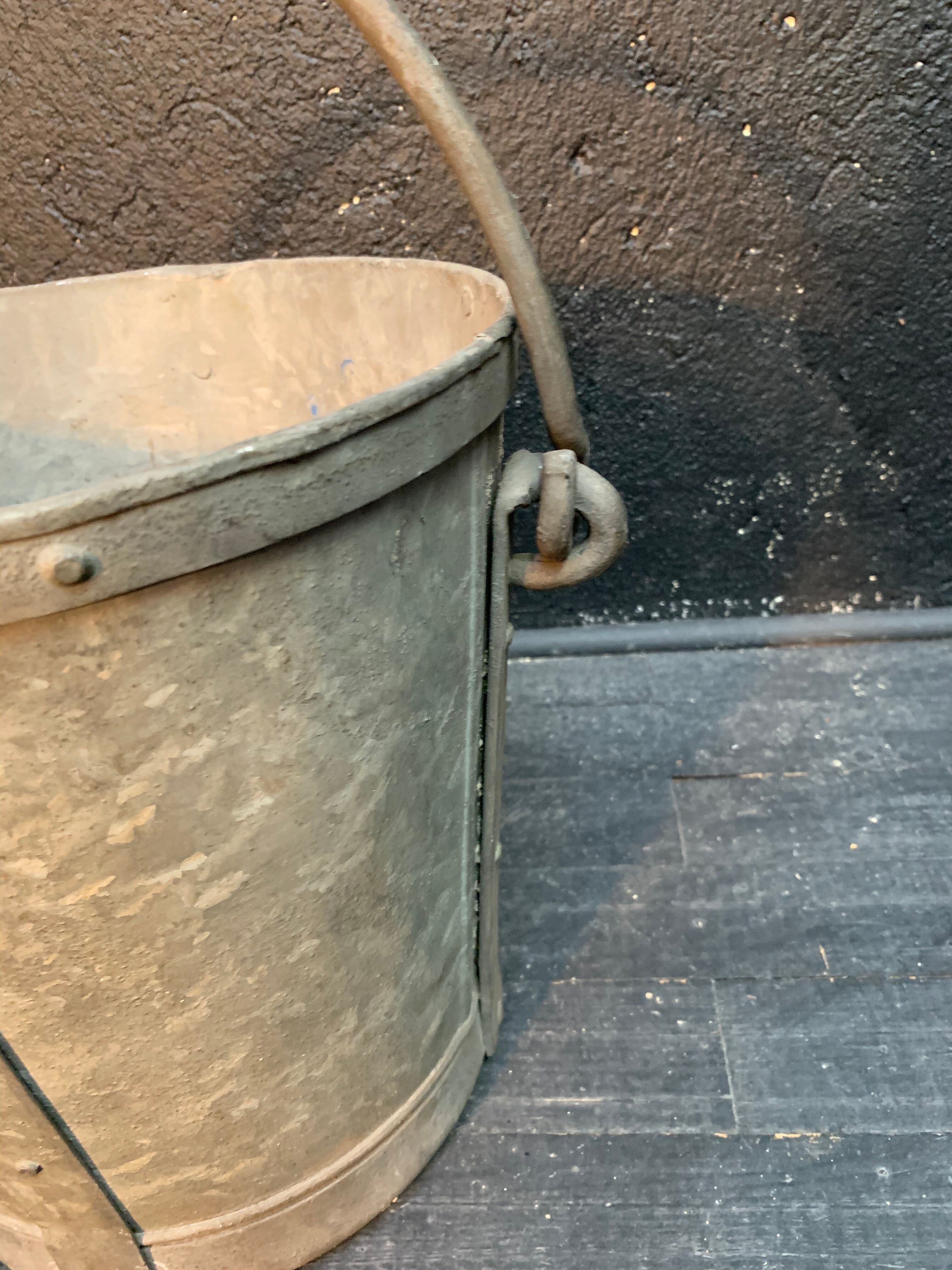 Ancient metal garden bucket