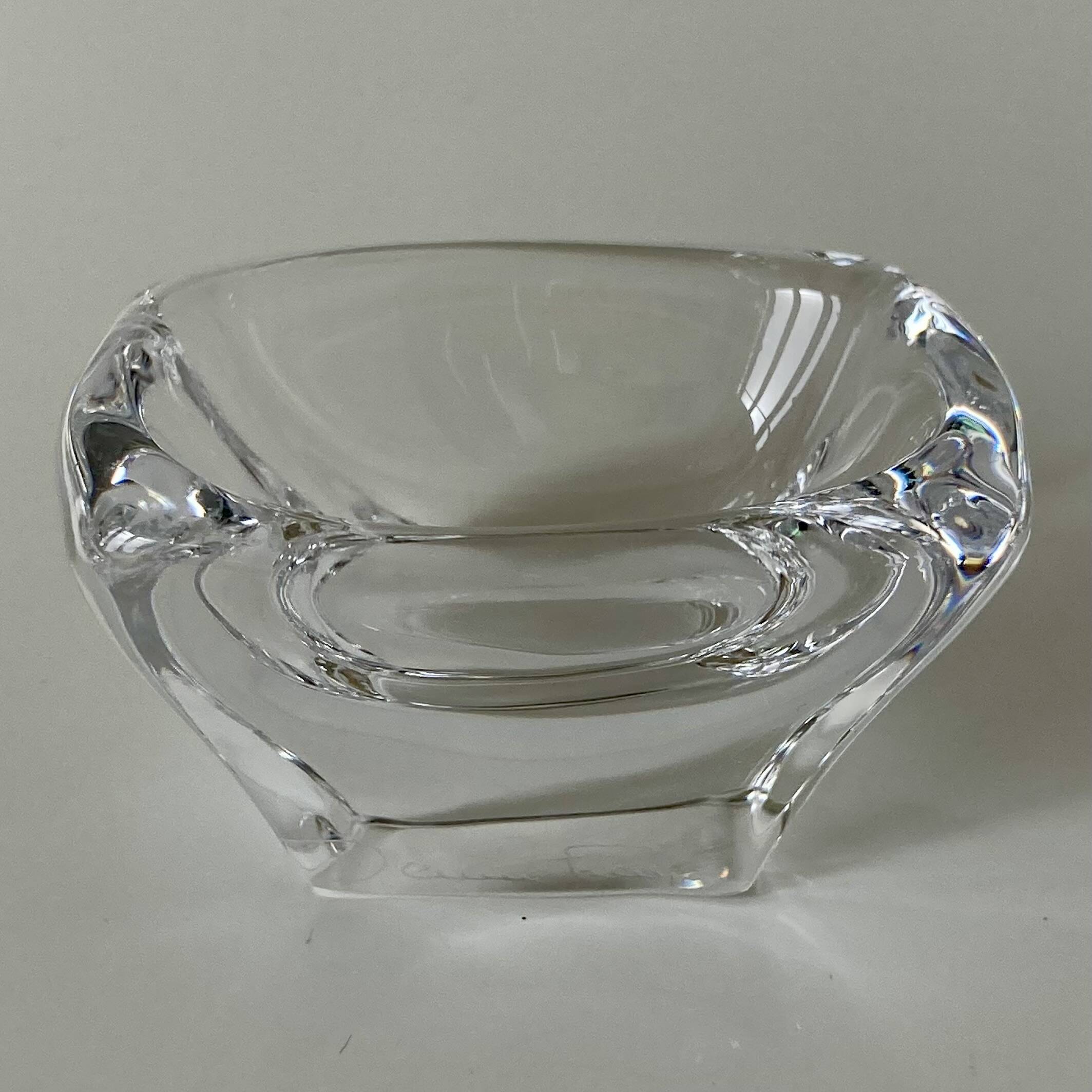 Pair of colourless crystal salt shakers from the Daum Nancy house.